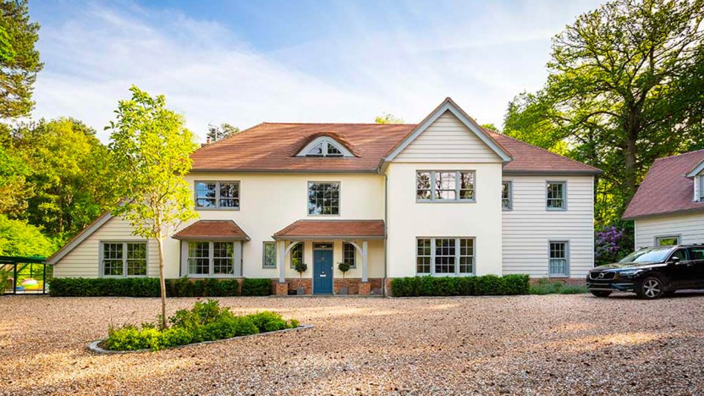 Big house with grey sliding sash windows