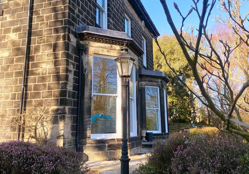 White sliding sash and bay windows on a period home