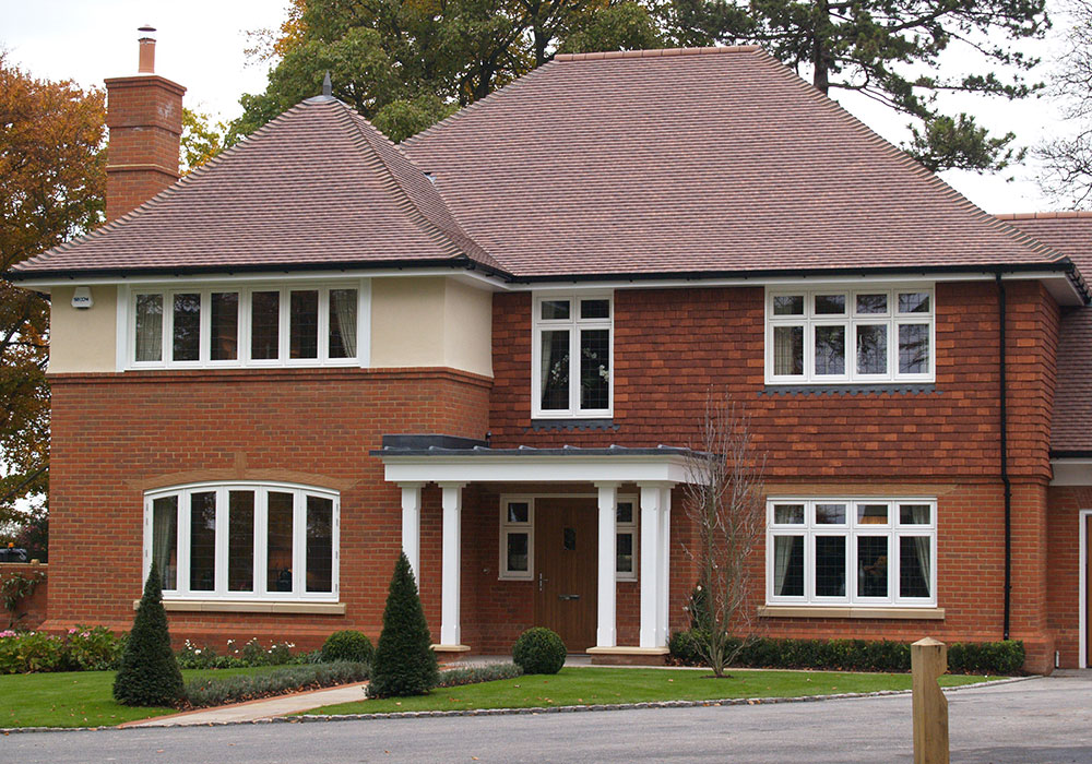 Traditional house with white flush casement windows